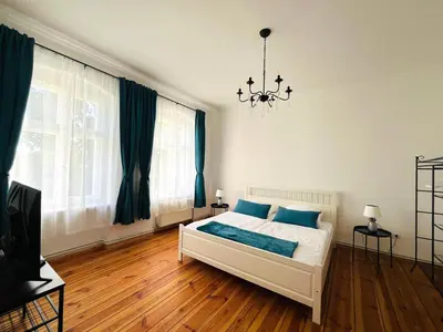 Ein Bett oder Betten in einem Zimmer der Unterkunft Besondere Ferienwohnung am Rande der Hauptstadt