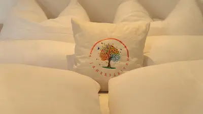 Ein Bett oder Betten in einem Zimmer der Unterkunft 4 Jahreszeiten