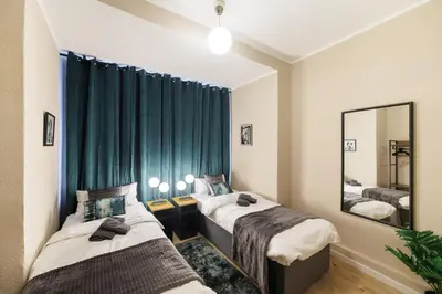 Ein Bett oder Betten in einem Zimmer der Unterkunft Deluxe Suites near Messe Berlin 8 Guests 2 Bathroom