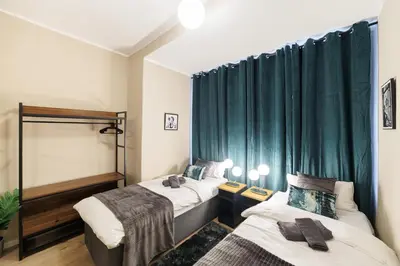 Ein Bett oder Betten in einem Zimmer der Unterkunft Deluxe Suites near Messe Berlin 8 Guests 2 Bathroom