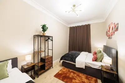 Ein Bett oder Betten in einem Zimmer der Unterkunft Deluxe Suites near Messe Berlin 8 Guests 2 Bathroom