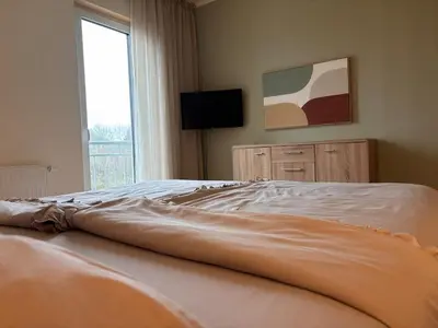 Ein Bett oder Betten in einem Zimmer der Unterkunft 3-room apartment