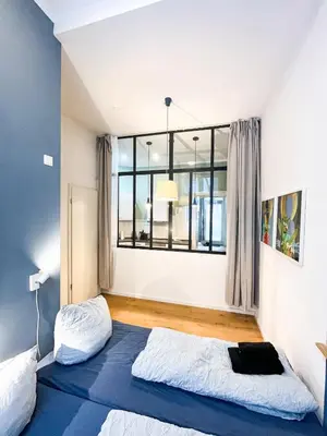 Ein Bett oder Betten in einem Zimmer der Unterkunft Cozy and compact in the center of Pberg