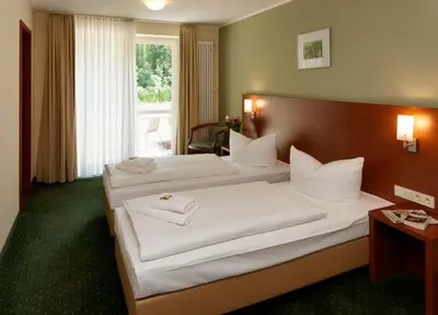 Ein Bett oder Betten in einem Zimmer der Unterkunft Märkisches Gildehaus Tagungs-und Congreßhotel des Handwerks GmbH
