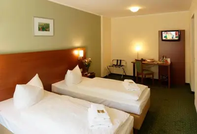 Ein Bett oder Betten in einem Zimmer der Unterkunft Märkisches Gildehaus Tagungs-und Congreßhotel des Handwerks GmbH
