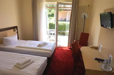 Ein Bett oder Betten in einem Zimmer der Unterkunft Märkisches Gildehaus Tagungs-und Congreßhotel des Handwerks GmbH