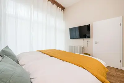 Ein Bett oder Betten in einem Zimmer der Unterkunft Moderne Design Apartments im Herzen von Prenzlauer Berg