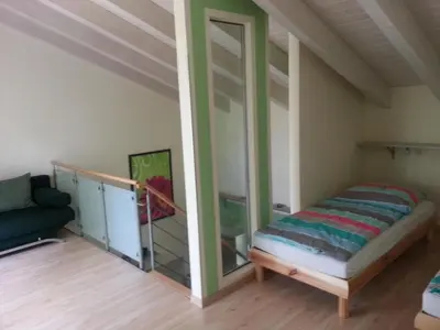 Ein Bett oder Betten in einem Zimmer der Unterkunft Apartment Moderne Maisonette-Wohnung mit Terrasse by Interhome