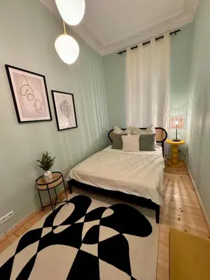 Ein Bett oder Betten in einem Zimmer der Unterkunft Cute Flat in Prenzlauer Berg