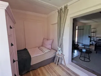 Ein Bett oder Betten in einem Zimmer der Unterkunft Landarbeiterhaus Hartensdorf