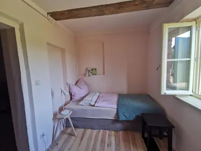 Ein Bett oder Betten in einem Zimmer der Unterkunft Landarbeiterhaus Hartensdorf