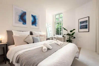 Ein Bett oder Betten in einem Zimmer der Unterkunft Spacious Apartment for 7 with Cinema Room