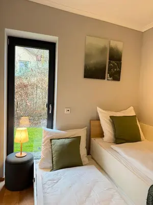 Ein Bett oder Betten in einem Zimmer der Unterkunft Auszeit am See mit Kamin und Whirlpool, Nähe Berlin