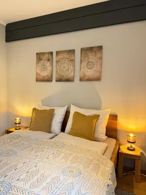 Ein Bett oder Betten in einem Zimmer der Unterkunft Auszeit am See mit Kamin und Whirlpool, Nähe Berlin