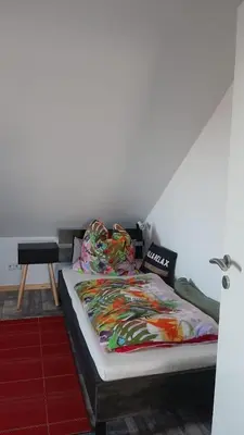 Ein Bett oder Betten in einem Zimmer der Unterkunft FEWO Königs Wusterhausen BER