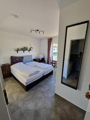 Ein Bett oder Betten in einem Zimmer der Unterkunft Galgenberghof Müncheberg