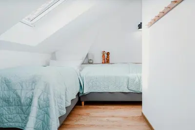 Ein Bett oder Betten in einem Zimmer der Unterkunft Gemütlicher Rückzugsort Im Bezaubernden Spreewald