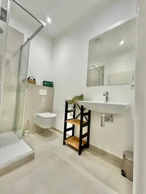 Ein Badezimmer in der Unterkunft City-Apartment mit Balkon U39-4