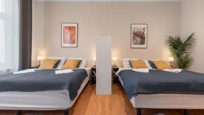 Ein Bett oder Betten in einem Zimmer der Unterkunft Yasmin Stay - Gemütliches Apartment in Friedrichshain - 75QM