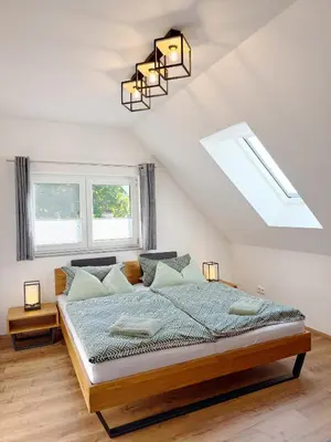 Ein Bett oder Betten in einem Zimmer der Unterkunft Ferienwohnung-Karwe