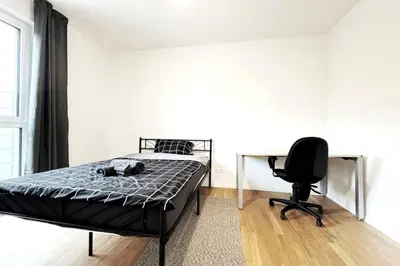 Ein Bett oder Betten in einem Zimmer der Unterkunft HolidayHome Apartments I Modern Apartment in Berlin-Lichtenberg