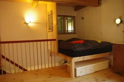 Ein Bett oder Betten in einem Zimmer der Unterkunft Gutshaus Buberow - Loft - für Seminare & Gruppen