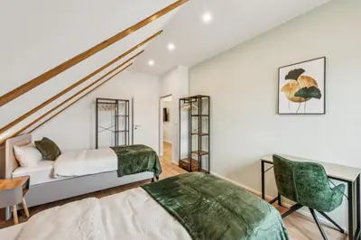 Ein Bett oder Betten in einem Zimmer der Unterkunft Ludwigsfelde Comfort Stay - 3BR Apartment