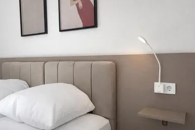 Ein Bett oder Betten in einem Zimmer der Unterkunft MUSE by Comfort Housing - 2 bedroom apartment