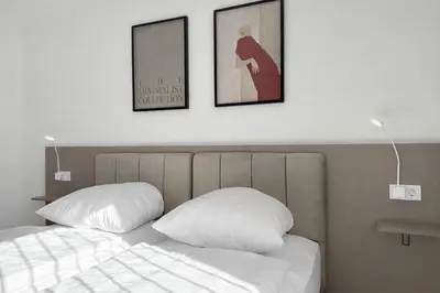 Ein Bett oder Betten in einem Zimmer der Unterkunft MUSE by Comfort Housing - 2 bedroom apartment