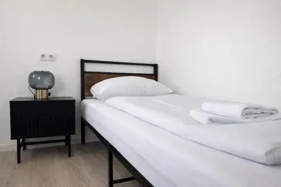 Ein Bett oder Betten in einem Zimmer der Unterkunft NOVA by Comfort Housing - 2 bedroom apartment