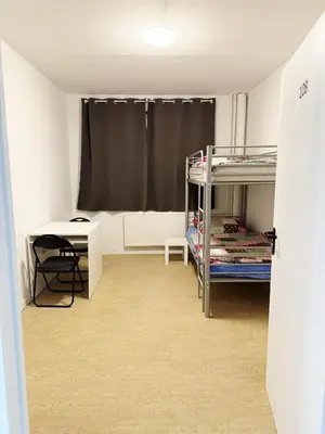 Ein Bett oder Betten in einem Zimmer der Unterkunft Almansi Hostel