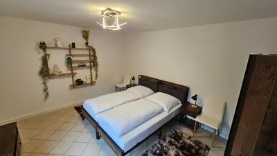 Ein Bett oder Betten in einem Zimmer der Unterkunft Fewo-OPR de Billi