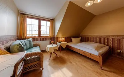 Ein Bett oder Betten in einem Zimmer der Unterkunft Hotel & Restaurant Landhaus Hönow