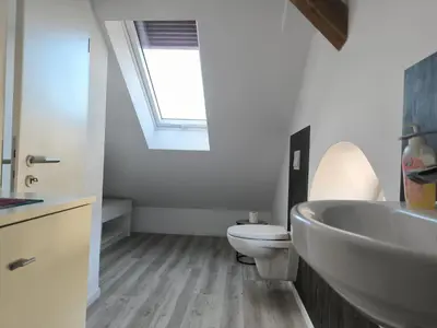 Ein Badezimmer in der Unterkunft Leuchtturmhus