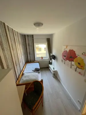 Ein Bett oder Betten in einem Zimmer der Unterkunft Pension am Markt Luckenwalde