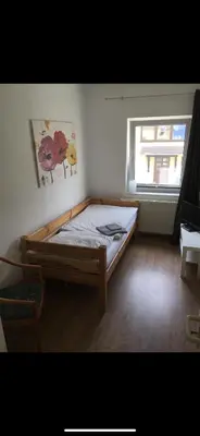 Ein Bett oder Betten in einem Zimmer der Unterkunft Pension am Markt Luckenwalde