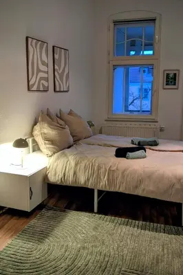 Ein Bett oder Betten in einem Zimmer der Unterkunft Großzügiges Familien-Apartment im Herzen Lübbens