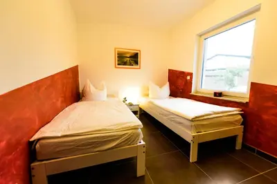 Ein Bett oder Betten in einem Zimmer der Unterkunft Spreewaldferienhäuser am Deich