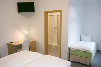 Ein Bett oder Betten in einem Zimmer der Unterkunft Lindencafe Luckenwalde