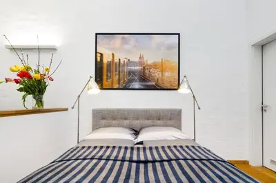Ein Bett oder Betten in einem Zimmer der Unterkunft The Melchior, Luxury Industry Loft in Mitte, group & family friendly, 2 bath rooms, big dining table, ideal for 4 - 6 Guests