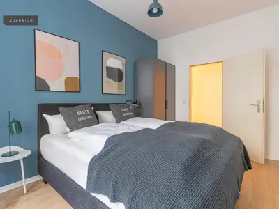 Ein Bett oder Betten in einem Zimmer der Unterkunft Apartments Berlin Niederbarnimstraße