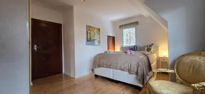 Ein Bett oder Betten in einem Zimmer der Unterkunft Ferienhaus Sanssouci