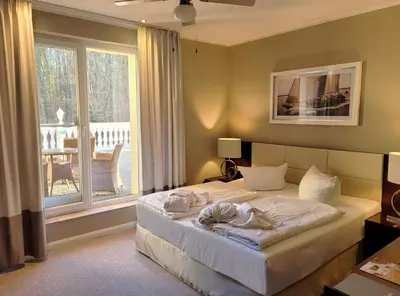 Ein Bett oder Betten in einem Zimmer der Unterkunft Hotel Resort Märkisches Meer
