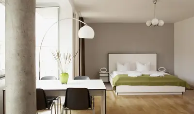 Ein Bett oder Betten in einem Zimmer der Unterkunft Karlito Apartmenthaus