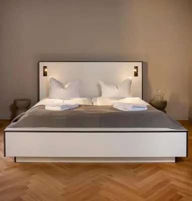 Ein Bett oder Betten in einem Zimmer der Unterkunft Karlito Apartmenthaus
