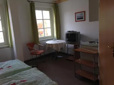 Ein Bett oder Betten in einem Zimmer der Unterkunft Landgasthaus am Dolgensee