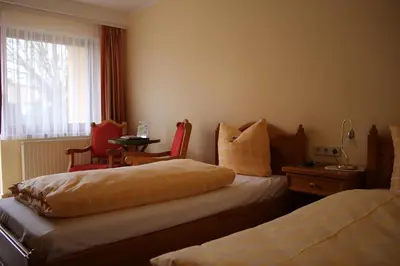 Ein Bett oder Betten in einem Zimmer der Unterkunft Bed & Breakfast Hotel Müllerhof