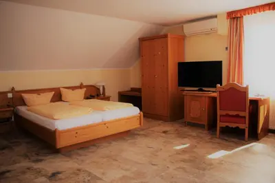 Ein Bett oder Betten in einem Zimmer der Unterkunft Bed & Breakfast Hotel Müllerhof