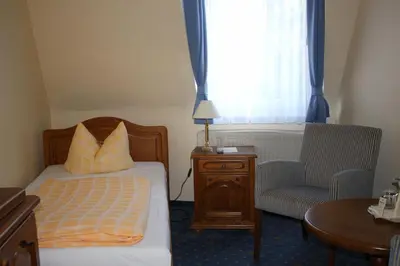 Ein Bett oder Betten in einem Zimmer der Unterkunft Bed & Breakfast Hotel Müllerhof