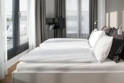 Ein Bett oder Betten in einem Zimmer der Unterkunft AMANO HOME Apartments